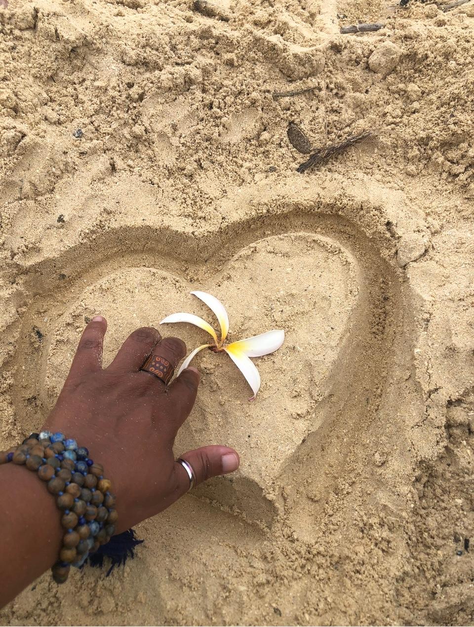 Hands with flowers — the gift of touch and healing